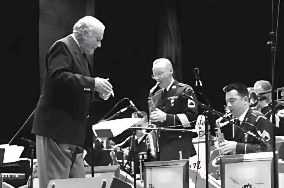 Hank Levy standing with members of the Jazz Ambassadors in January 1997